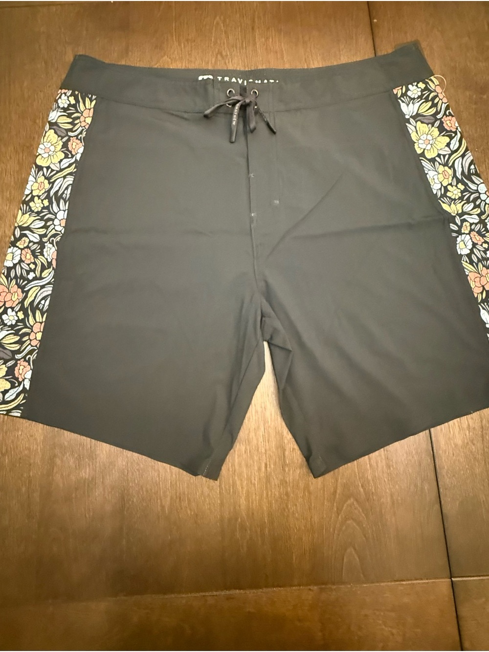 Travis Mathew Black Swim Shorts with Floral Side Panels